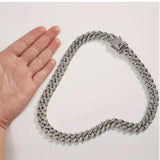 Silver-tone Iced-Out Pet Choker shown beside a hand for scale